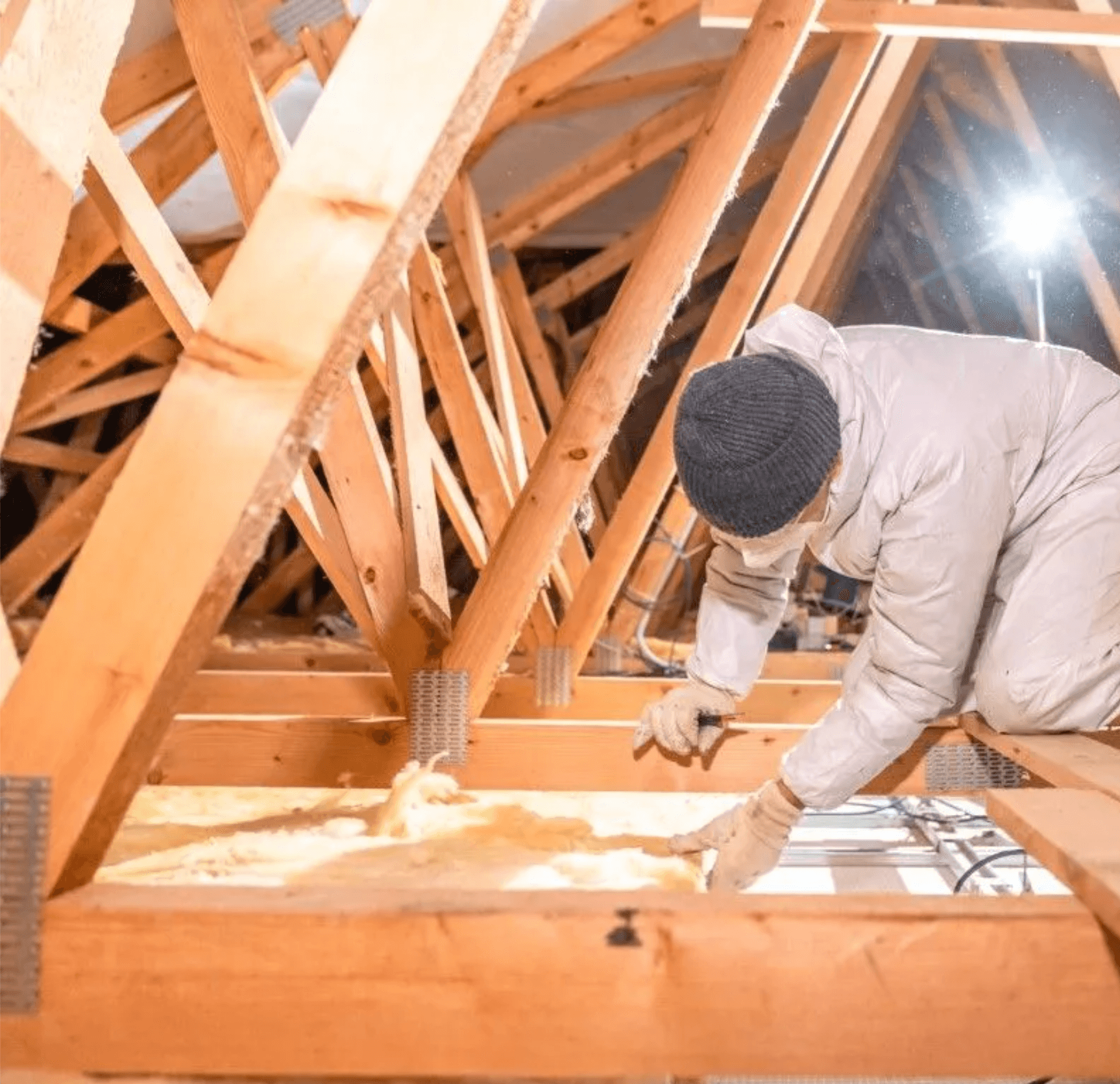 Installer preparing attic framing for spray foam insulation in Vancouver